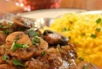 Marsala Glazed Pork Chops Served with Golden Saffron Risotto