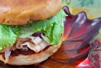Mediterranean Style Pesto Turkey Bagels with Sun Dried Tomato and Basil