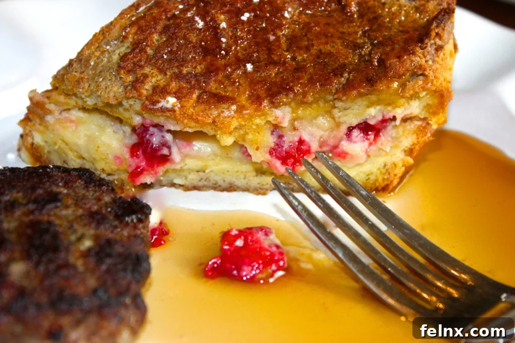 Close-up of golden brown stuffed French toast with lemon curd filling