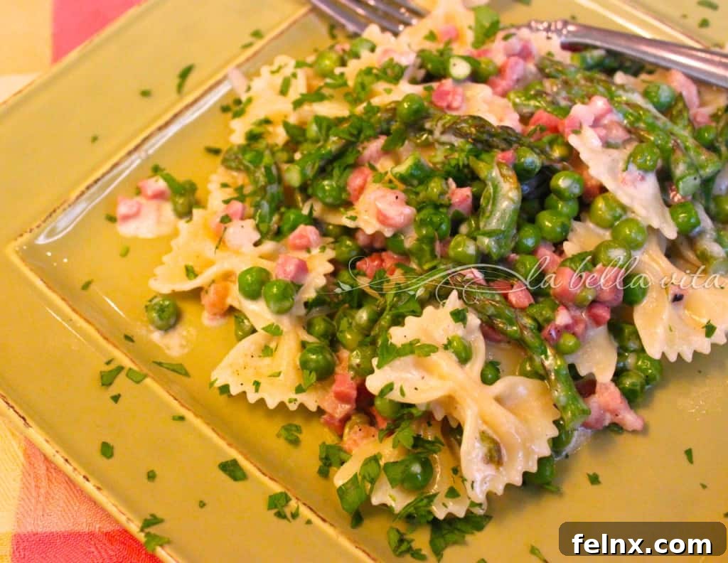 Farfalle pasta with cream sauce and vegetables