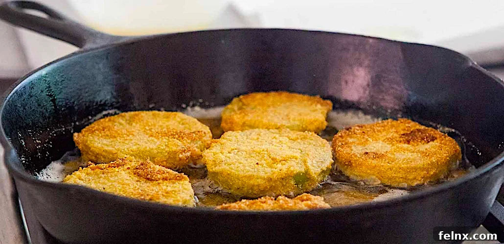 frying green tomatoes in a skillet