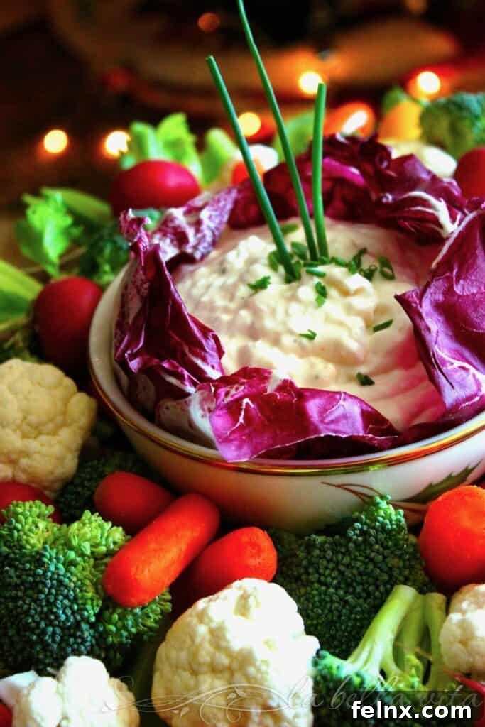 The Best Vegetable Dip displayed with fresh carrots and broccoli