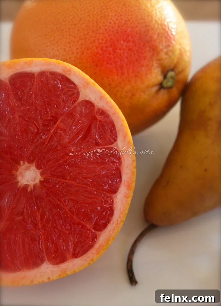 Ruby red grapefruit and pears sliced and ready for blending