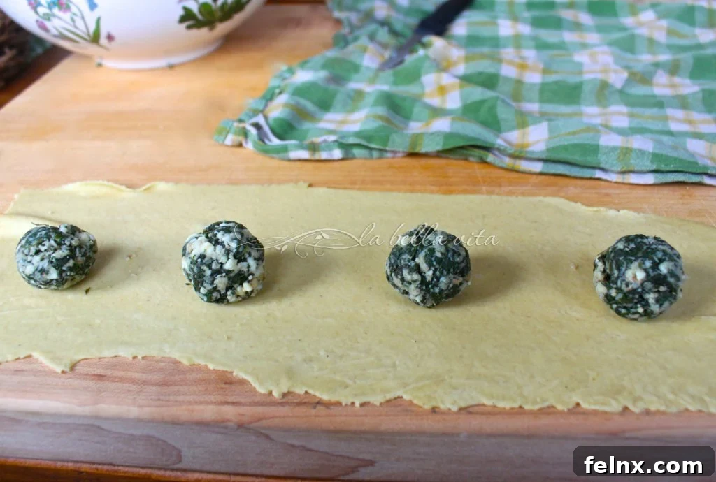 The process of adding filling to the pasta sheets
