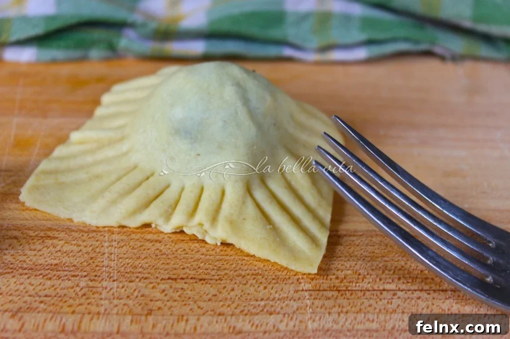 Crimping the edges of ravioli with a fork