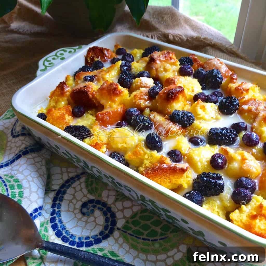 Fresh Blackberry and Blueberry Bread Pudding with a shiny Limoncello Glaze