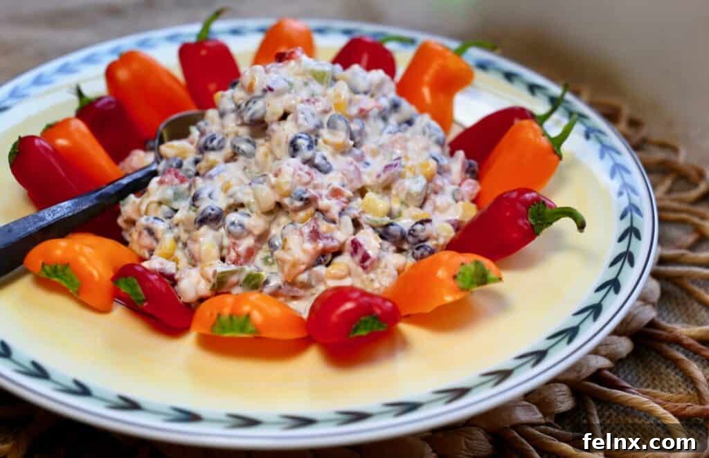 Cheesy Fiesta Corn Dip on a yellow platter