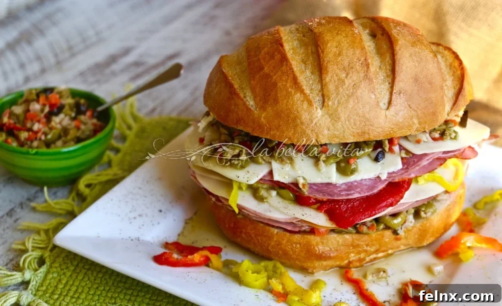 A massive Muffuletta sandwich showing all the delicious layers
