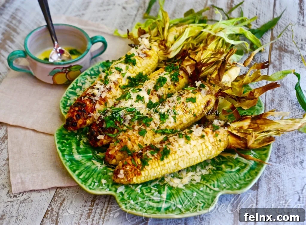 Delicious Grilled Italian Corn with Garlic-Basil Butter on a platter