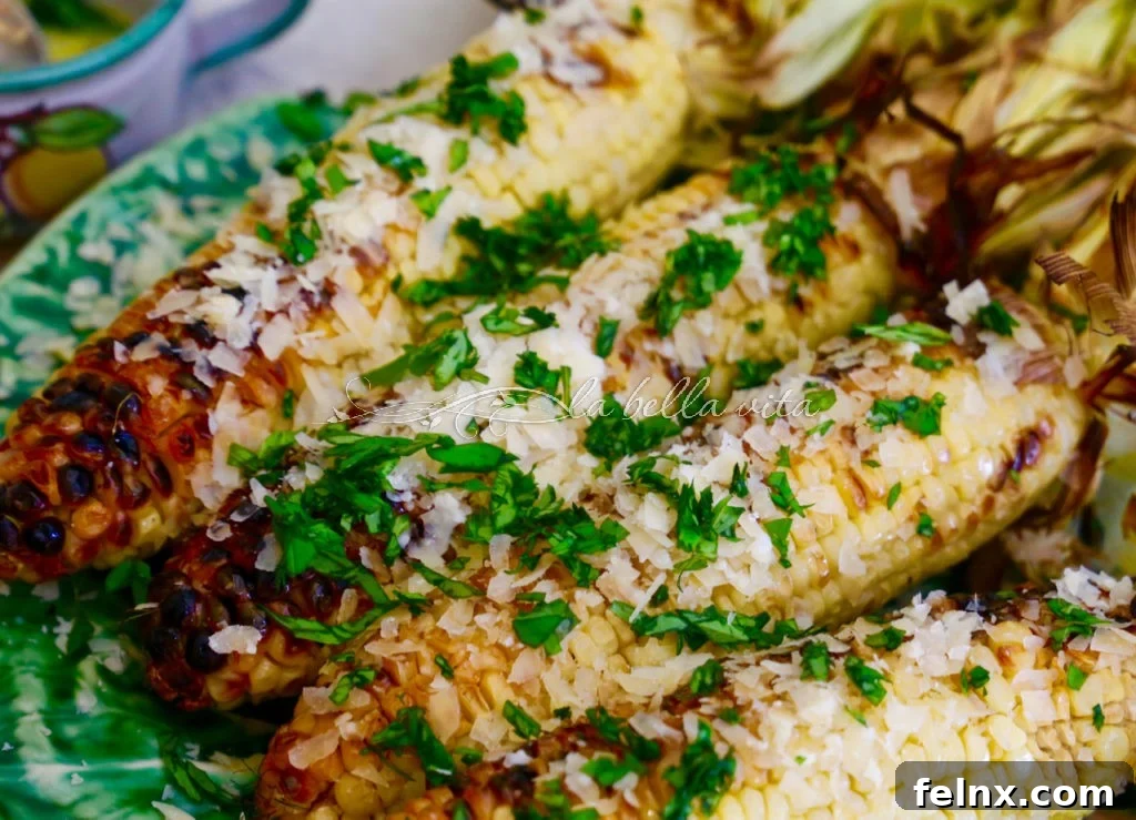 Close up of grilled corn with melted basil butter
