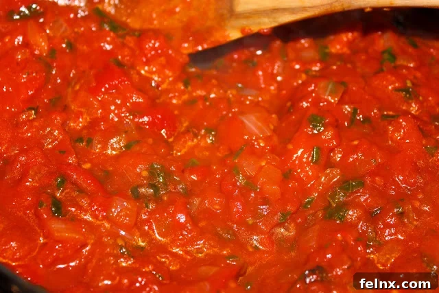 Red pepper sauce simmering on the stove
