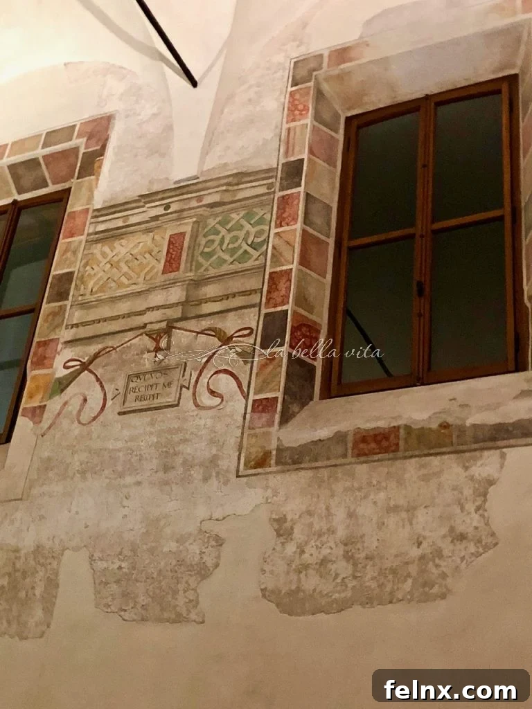 Original artwork remains on the walls of the refectory