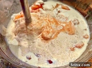 Using an immersion blender on the ice cream base