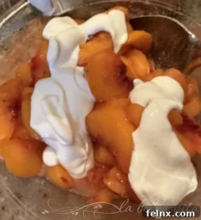 Mixing sour cream into the peach mixture