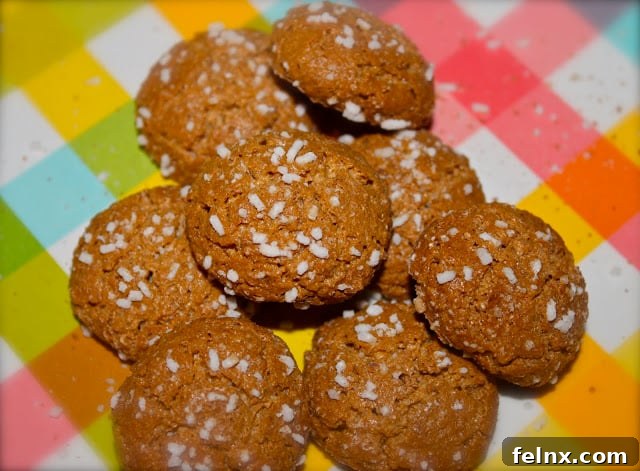 Two small almond cookies inside their wrapper
