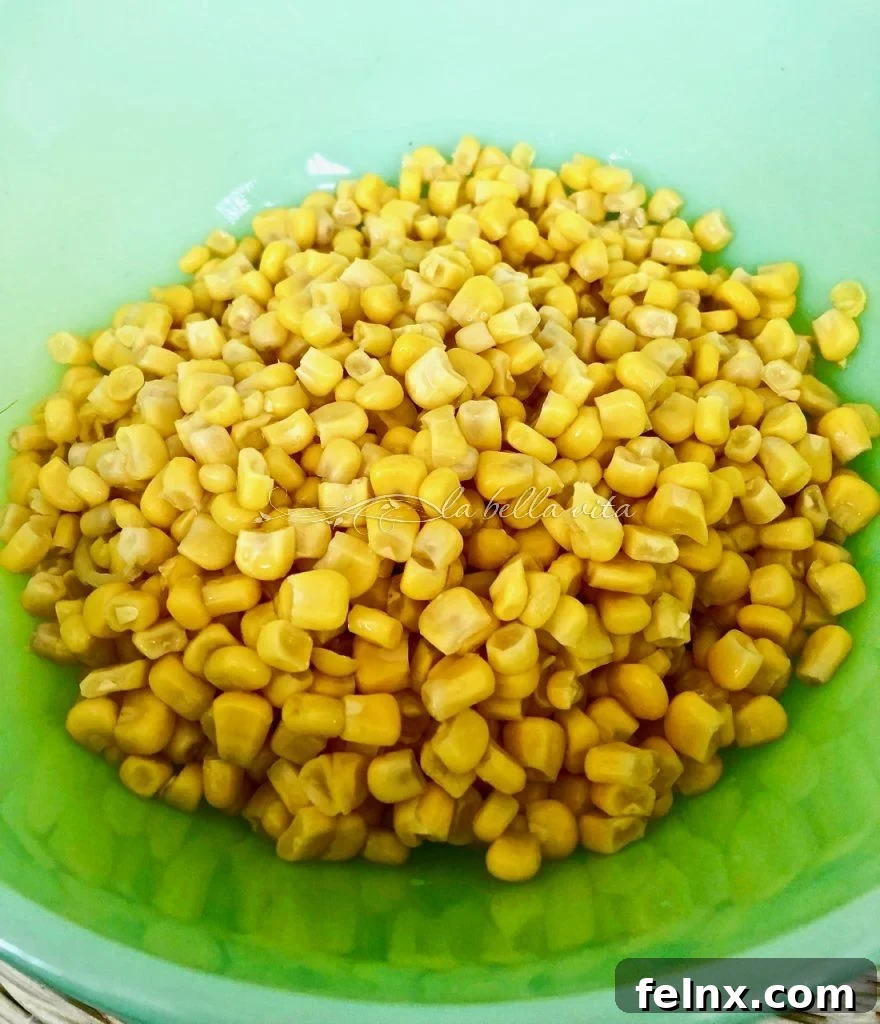 Zesty Sweet Corn and Black Eyed Pea Medley 3 Adding corn to the bowl