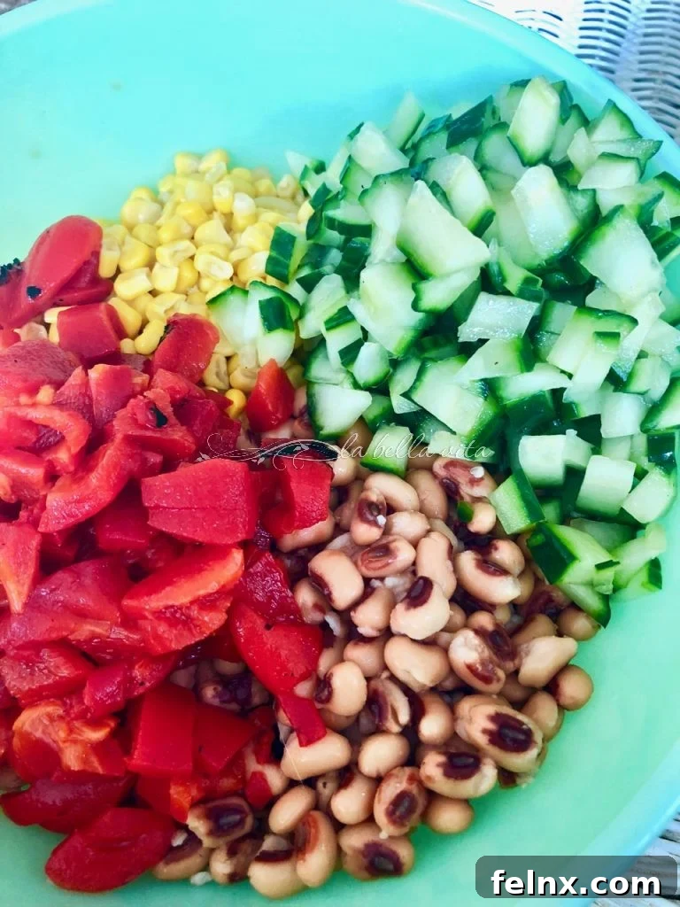 Zesty Sweet Corn and Black Eyed Pea Medley 8 Adding chopped cucumber