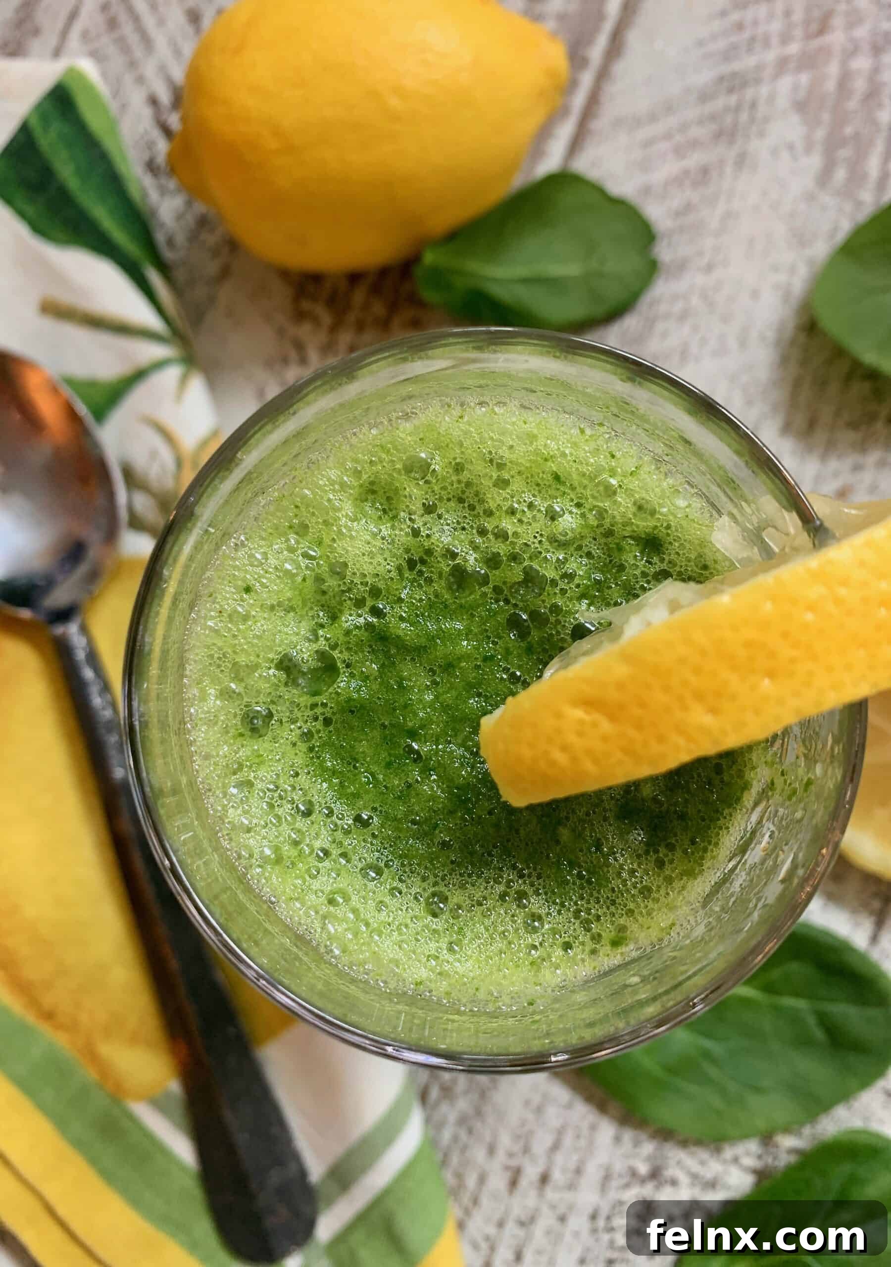 Vertical shot of pineapple spinach ginger smoothie