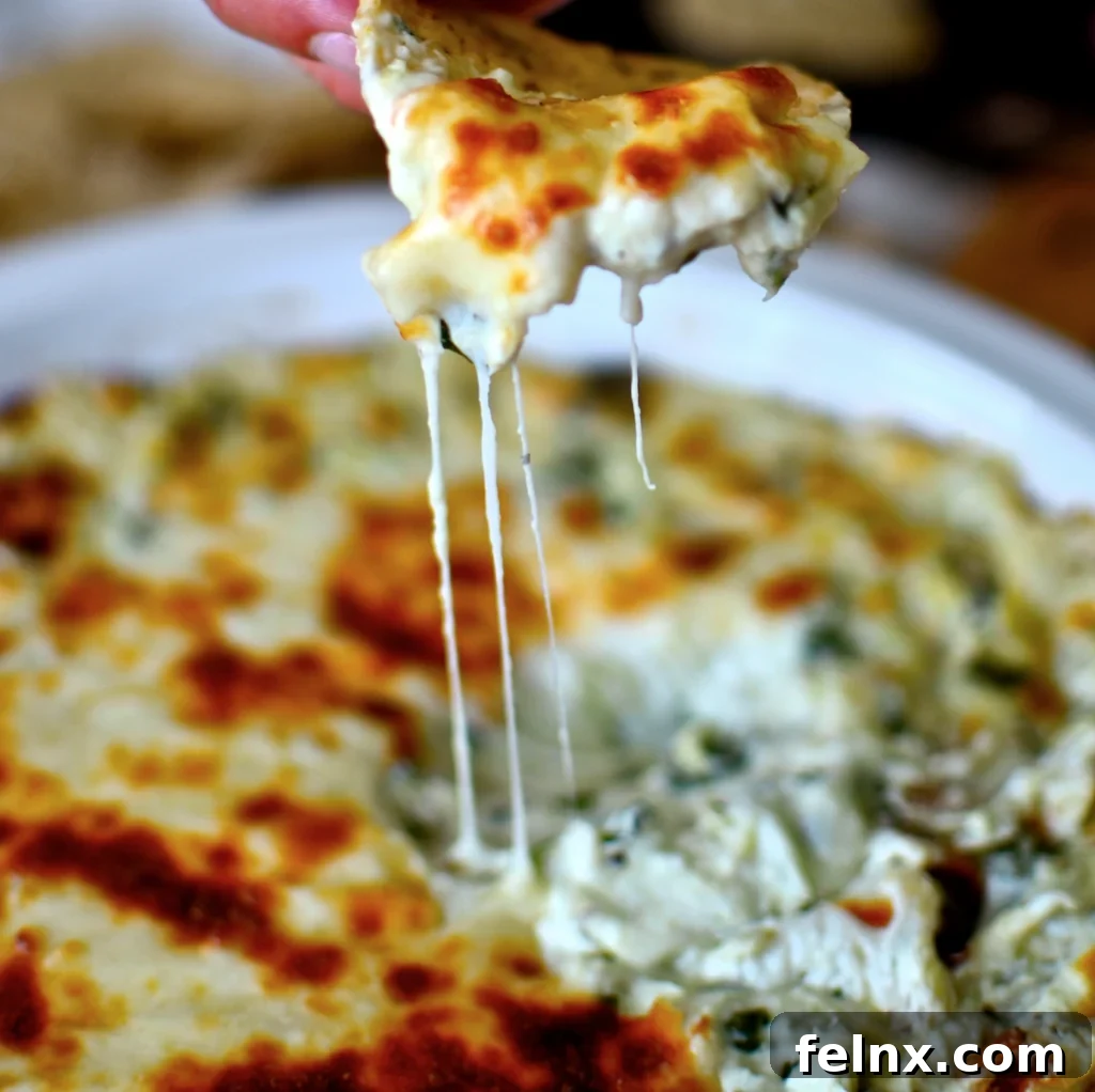 Warm Cheesy Asiago and Spinach Artichoke Dip