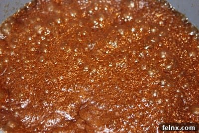 Caramel glaze bubbling on the stove