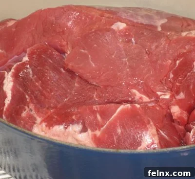 Searing the beef in a pan