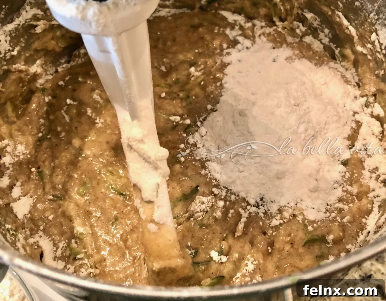 Adding flour to the zucchini banana mixture