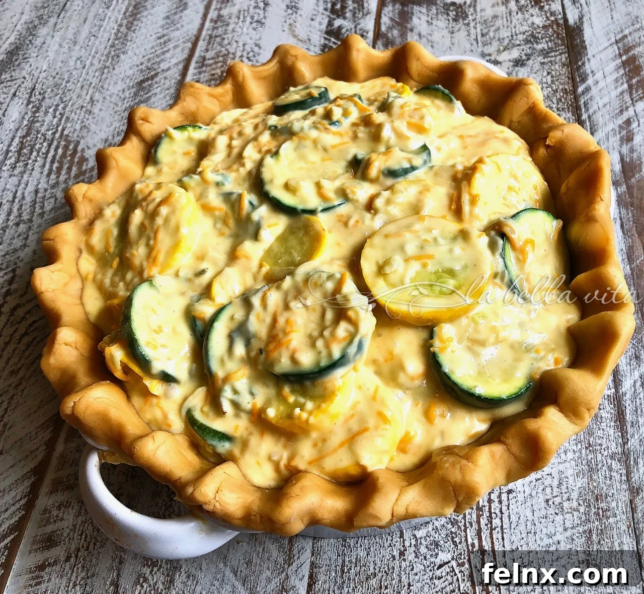 Filling the crust with the zucchini mixture