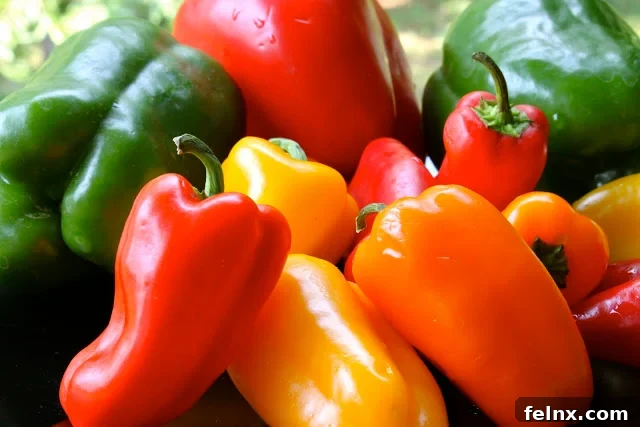 A vibrant mix of sliced peppers and tomatoes
