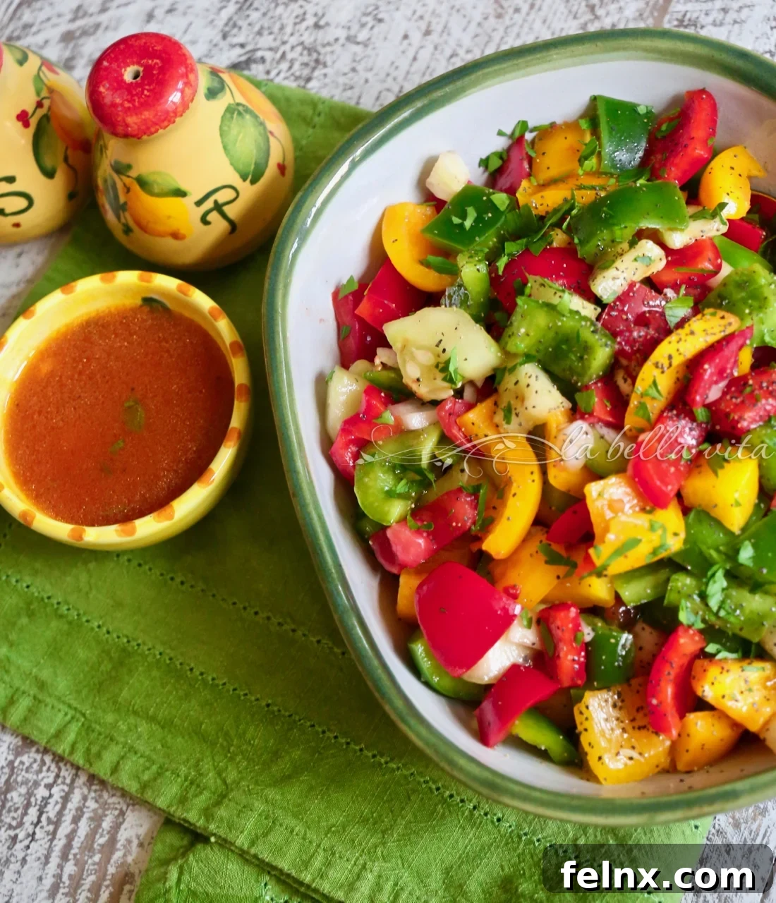 Mixing the salad with a light vinaigrette