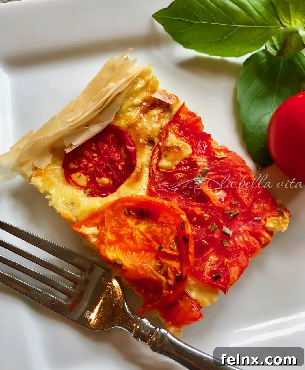 Close up of sliced tomato tart layers