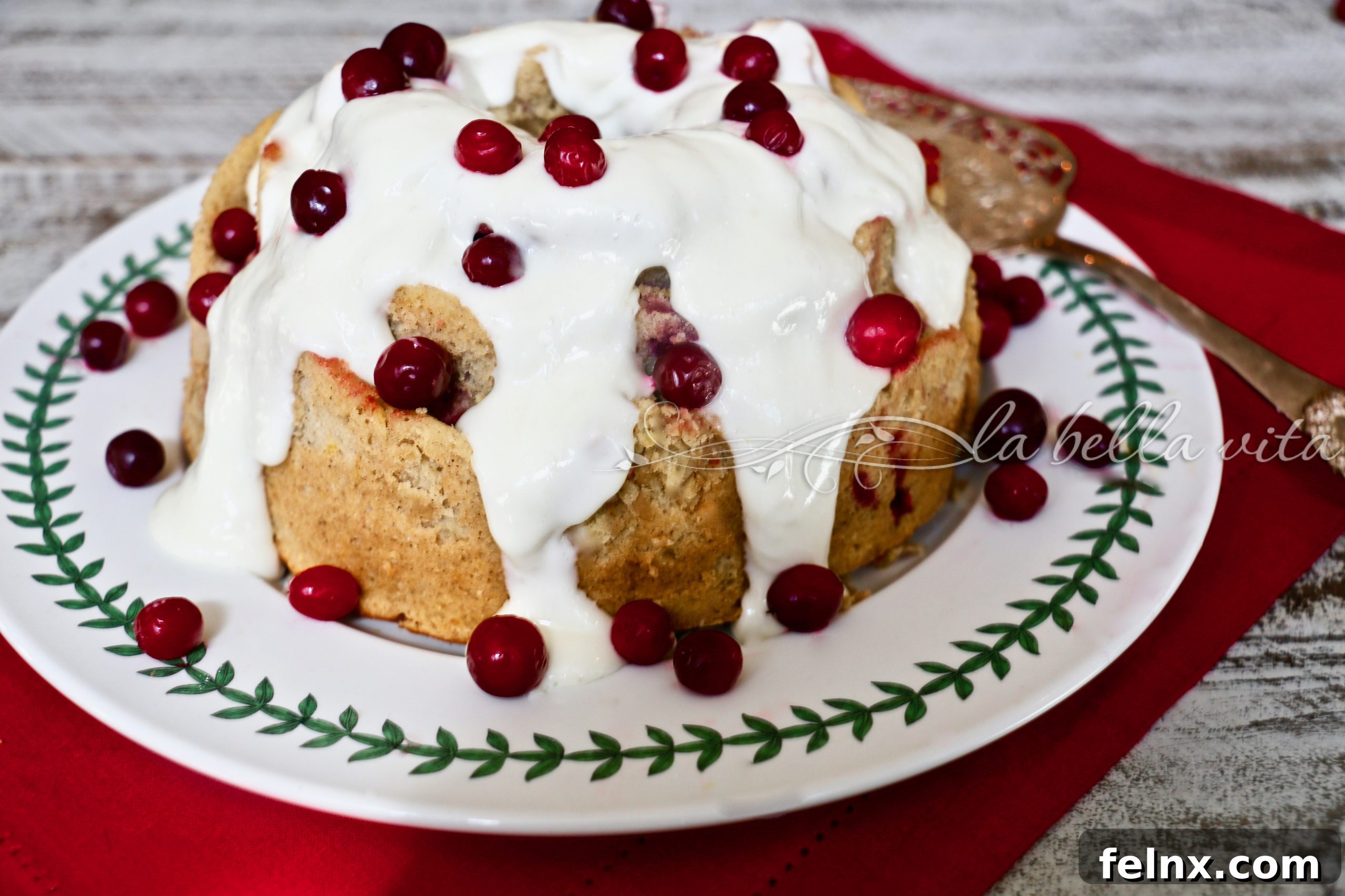 Whole Italian Cranberry Orange Bundt Cake on a serving platter
