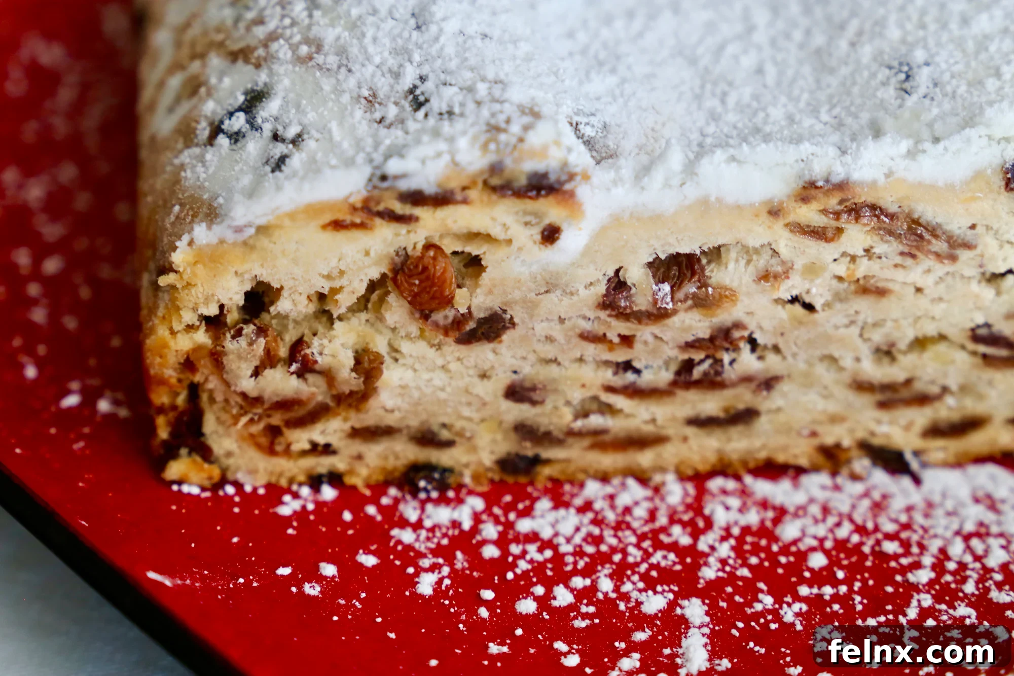 Close-up of powdered sugar dusted Stollen bread