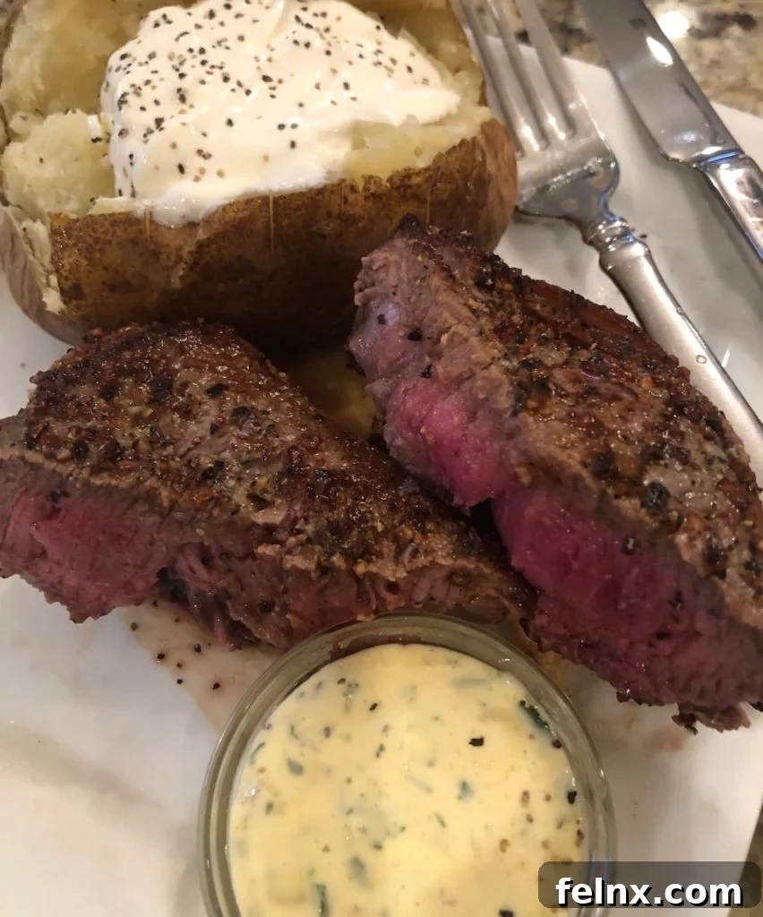 Steak topped with thick Bearnaise sauce