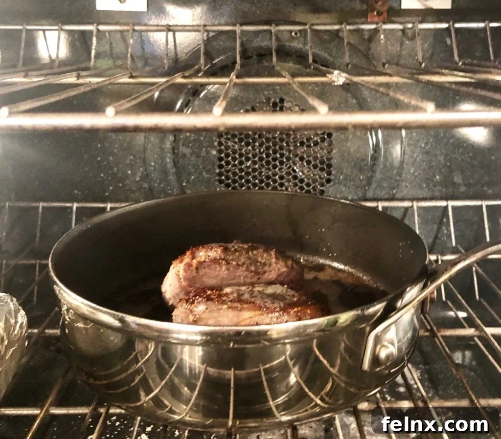 Steak being checked with a thermometer