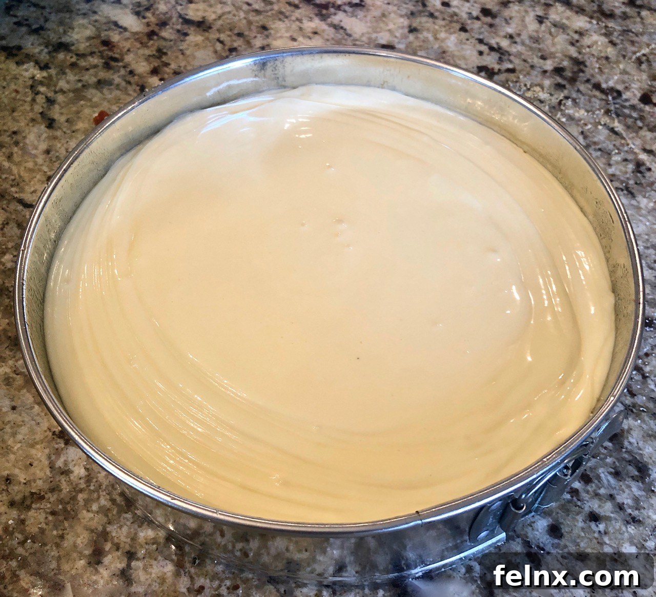 Cheesecake placed in the oven