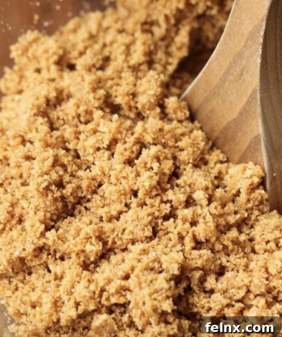 Mixing graham cracker crumbs with butter