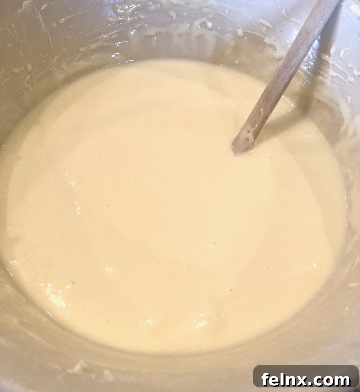 Finished cheesecake batter in a bowl