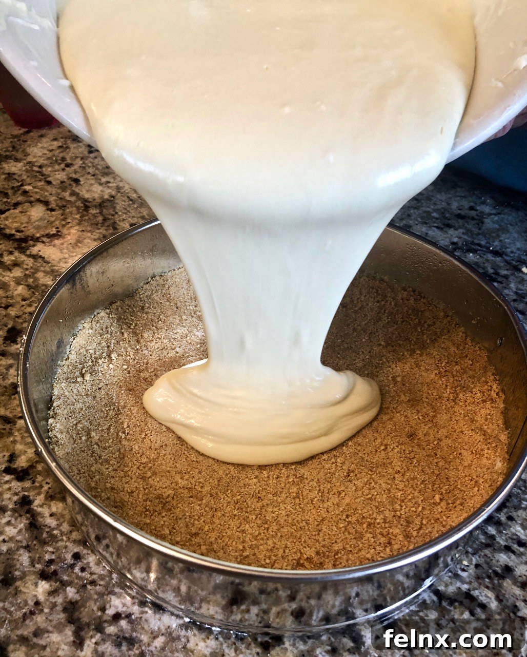 Pouring batter into the crust