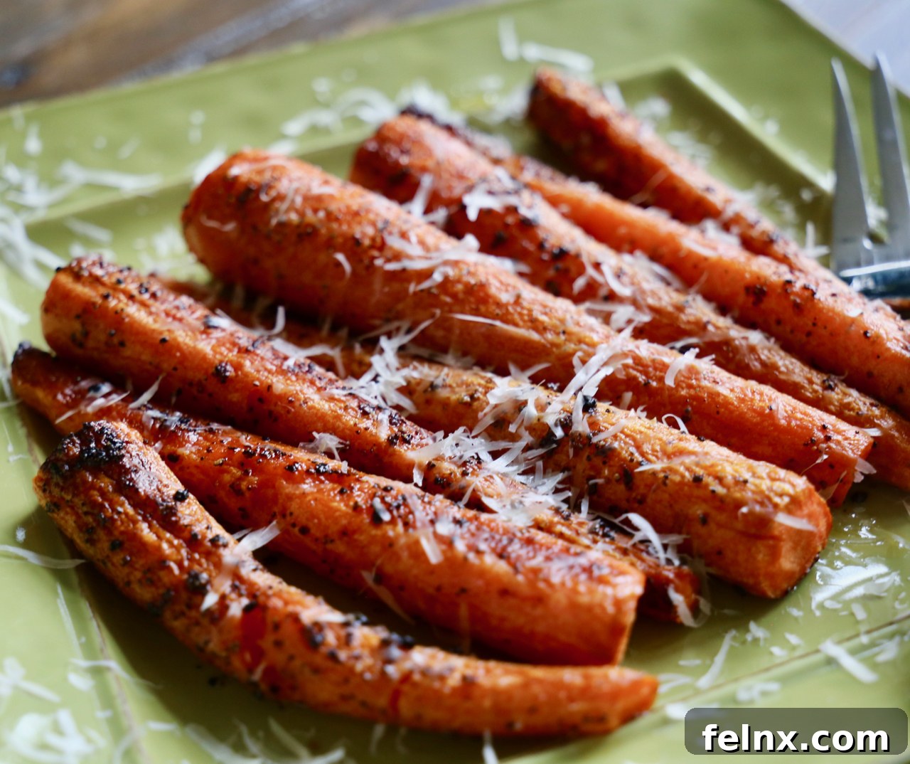 Freshly roasted carrots coming out of the oven