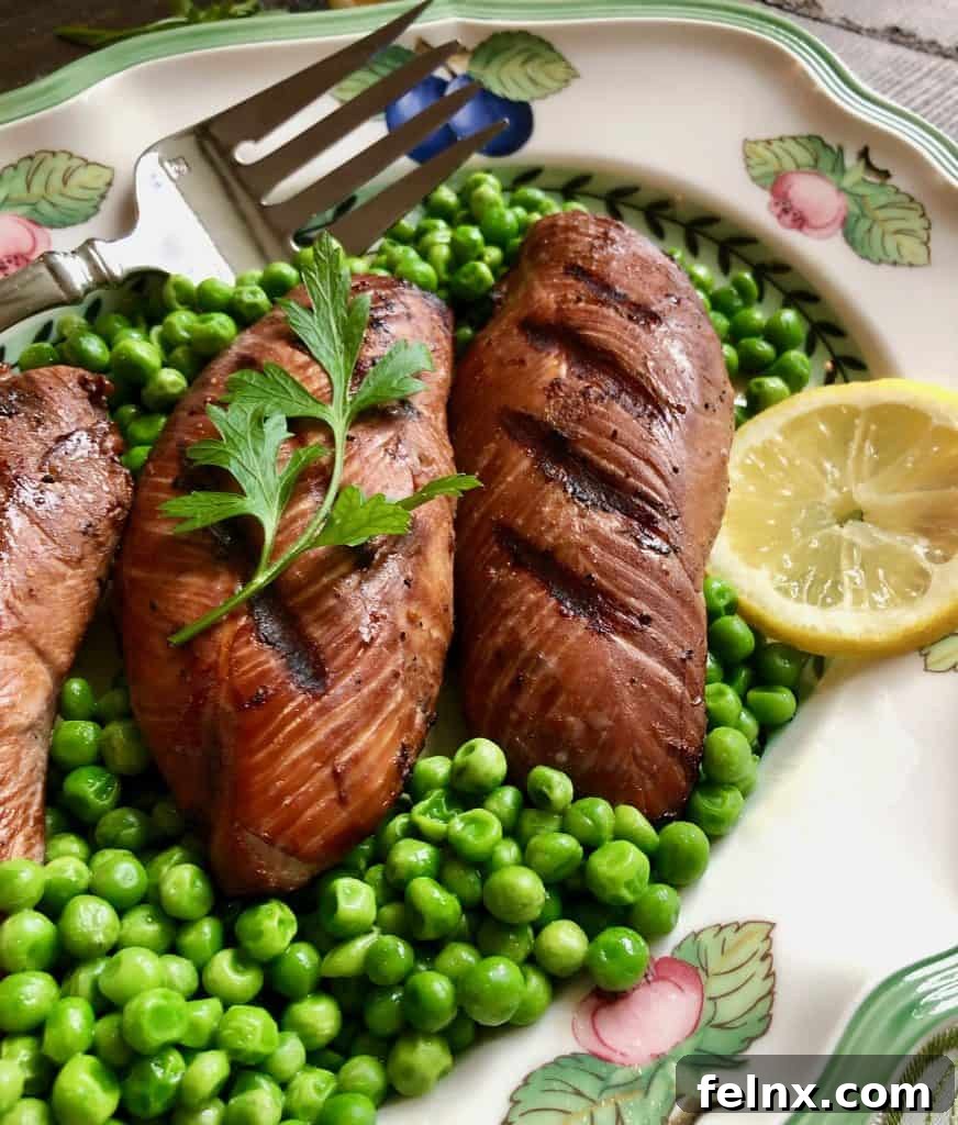 Close up of marinated grilled turkey breasts showing a perfect sear.