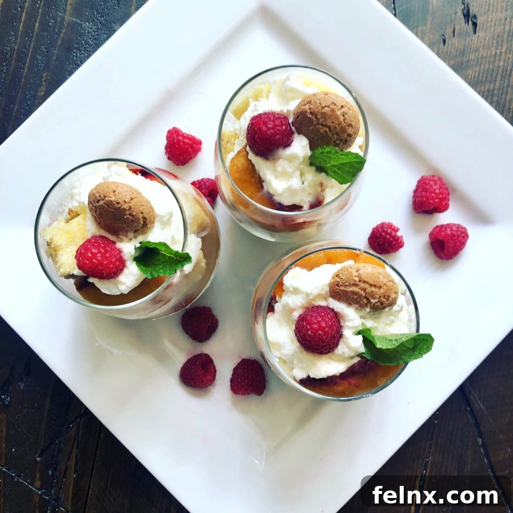 Exquisite layering of peach parfaits in tall glasses