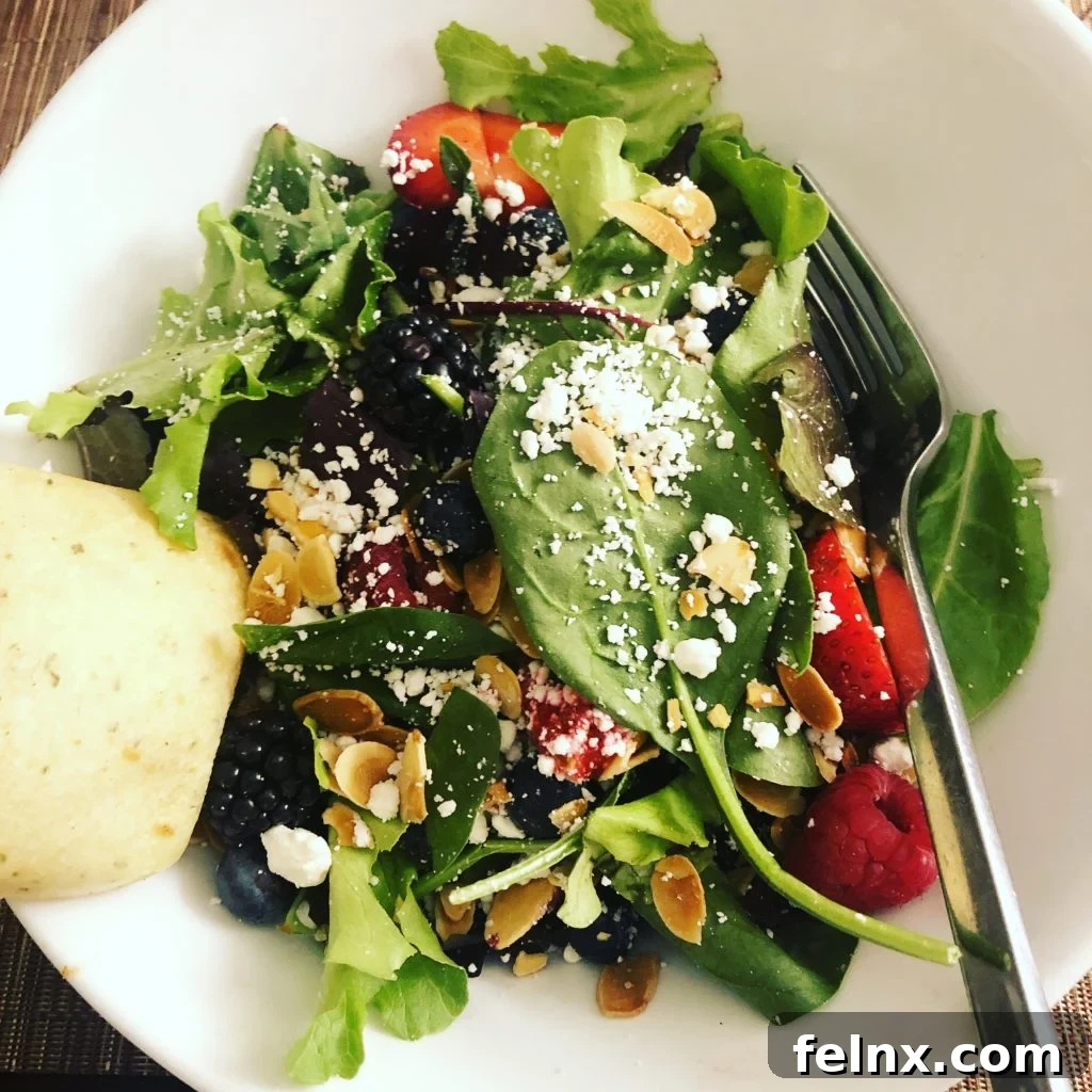 Fresh salad with berries and goat cheese