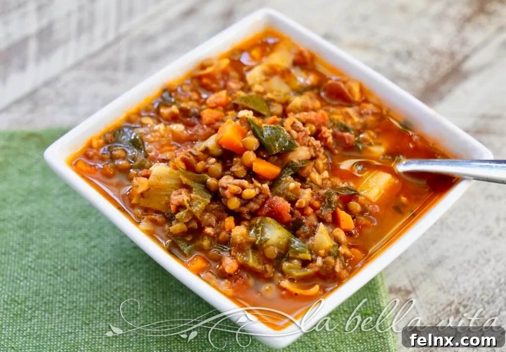 Close up of hearty lentil stew with sausage