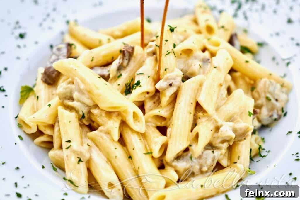 Chef preparing creamy truffle sauce in a copper pan