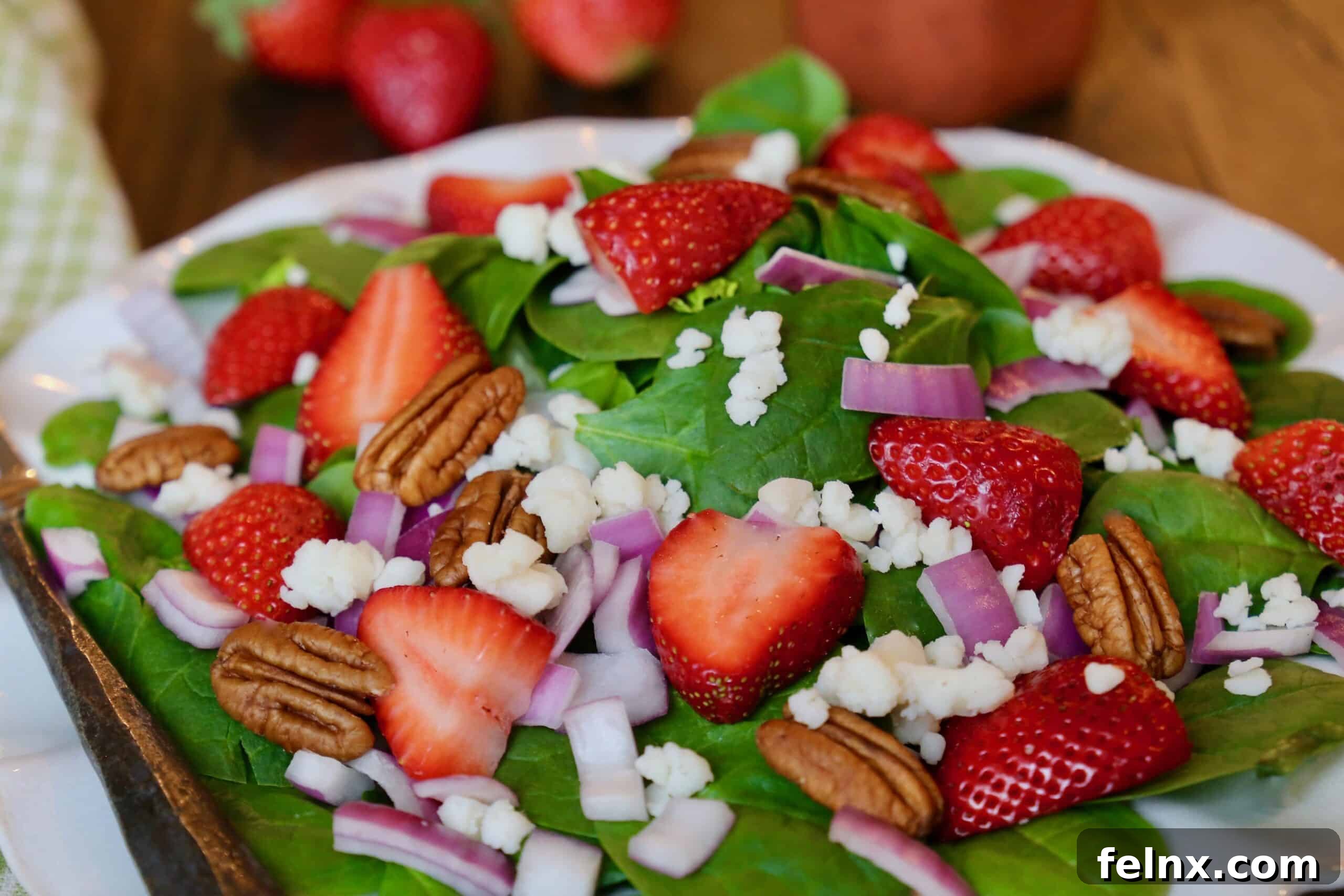 Plated Strawberry Spinach Salad ready to be served