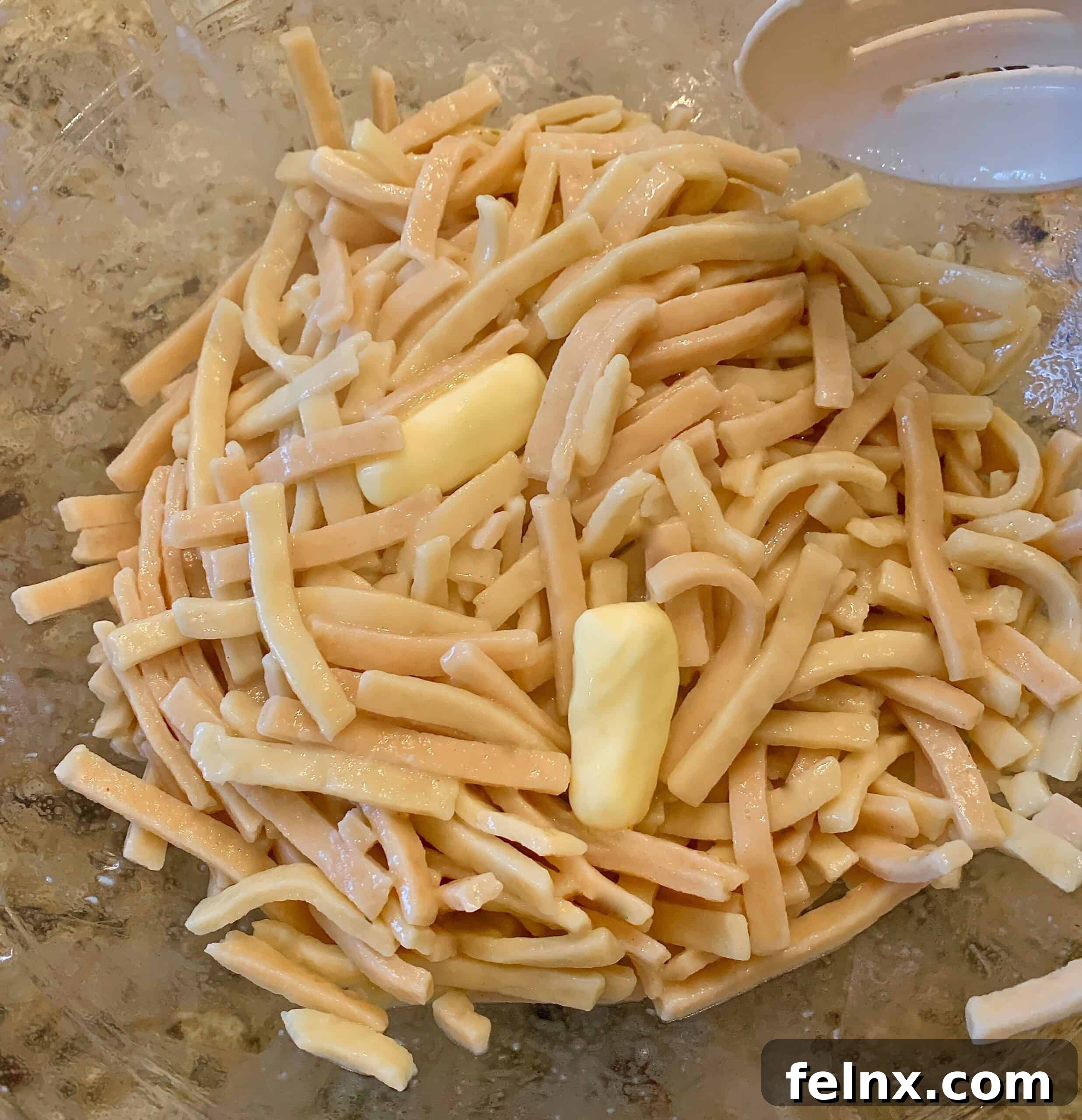 Buttered noodles ready for mixing