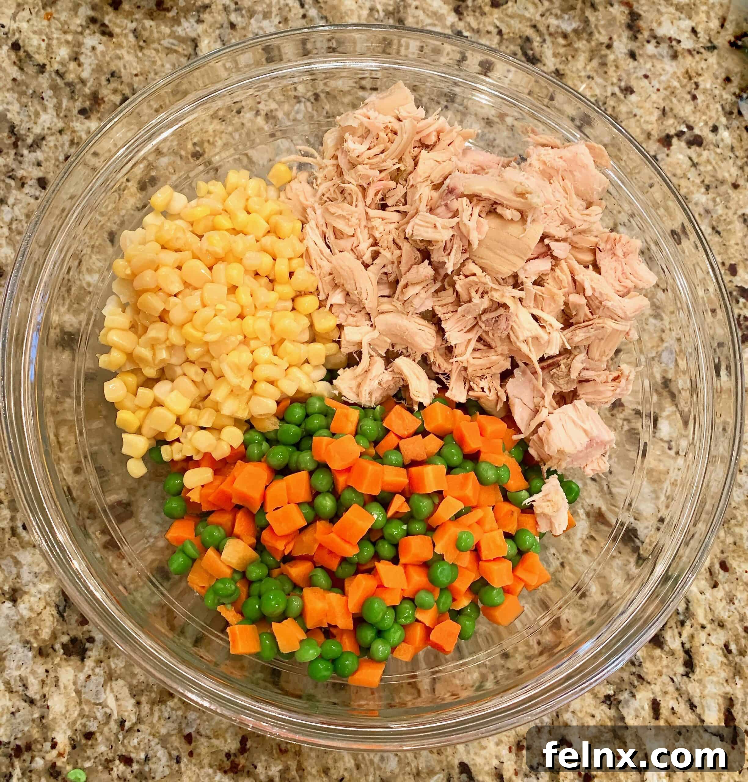 Mixing chicken and vegetables