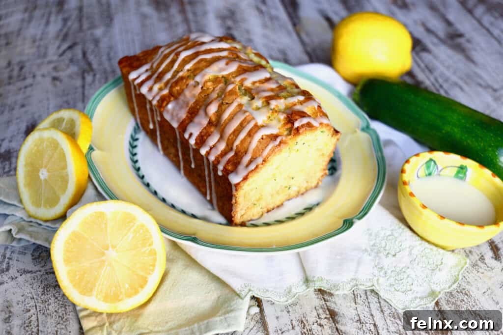 Sliced lemon zucchini bread with citrus glaze