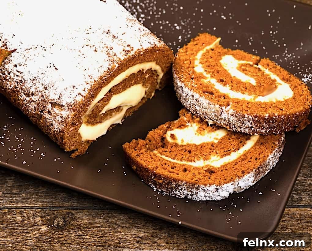 Finished pumpkin roll dusted with powdered sugar