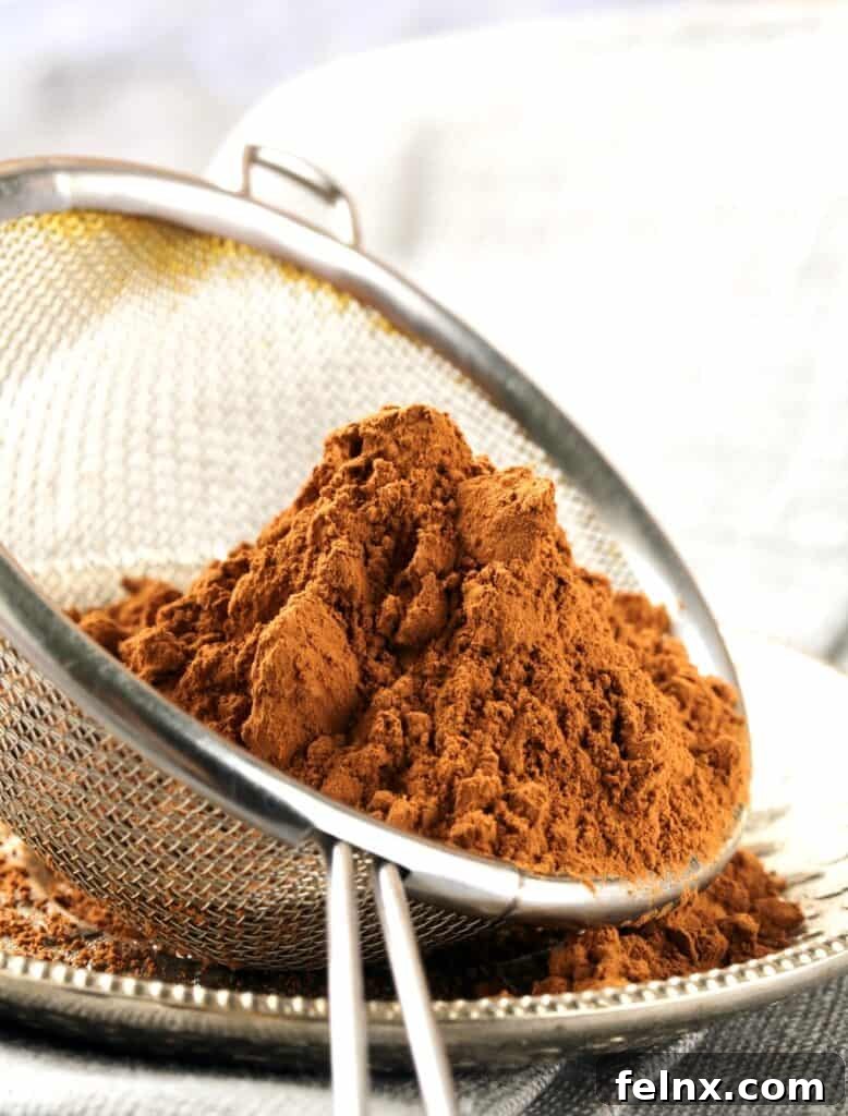 Sifting cocoa powder for brownies
